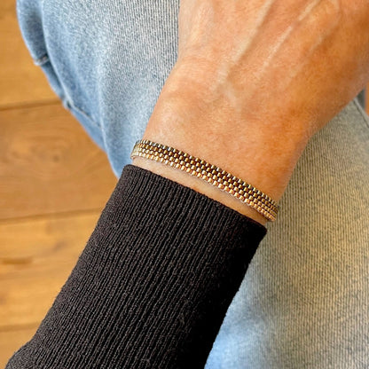 Minimalist pewter tone metallic horizontal stripes beaded bracelet.