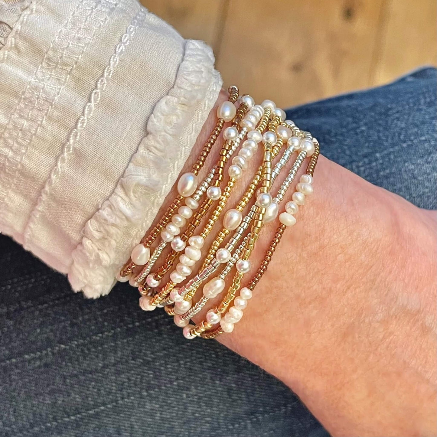 Mixed metal pearl beaded bracelets. Freshwater pearls and tiny rose gold, yellow gold, and silver seed beads. Dainty bracelet stack.