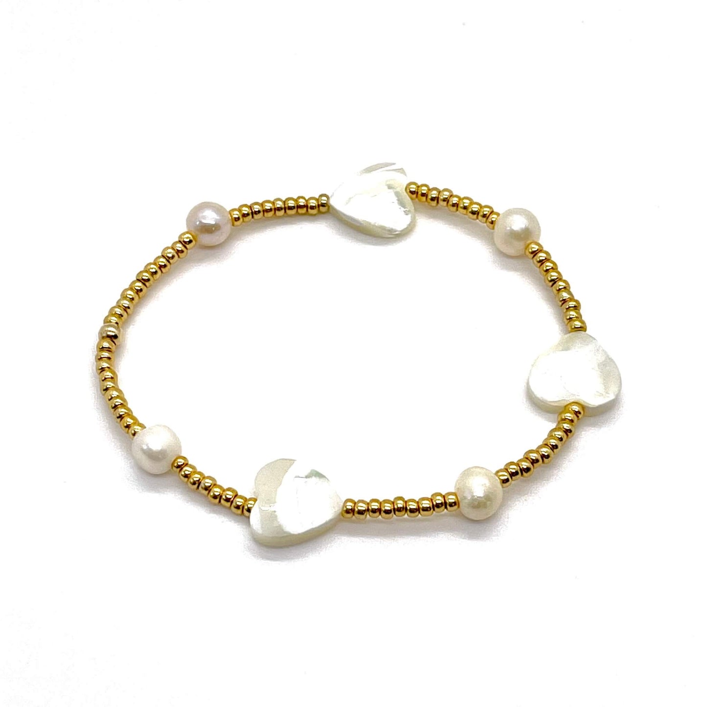 Mother-of-pearl heart bracelet with tiny gold-tone beads, freshwater rondelle beads, and mother-of-pearl heart beads.