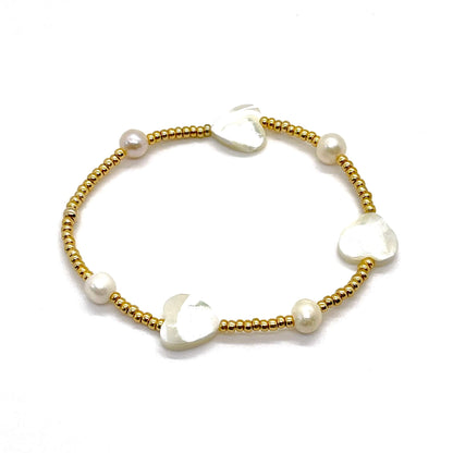 Mother-of-pearl heart bracelet with tiny gold-tone beads, freshwater rondelle beads, and mother-of-pearl heart beads.