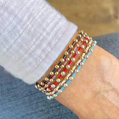 Trendy stretch bracelets for women. Stackable bracelets with seed beads, gold beads, or silver beads.