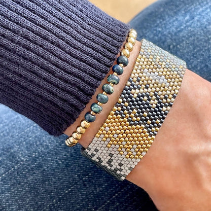 Ombre gold and blue woven bracelet and gold stretch bracelet set.