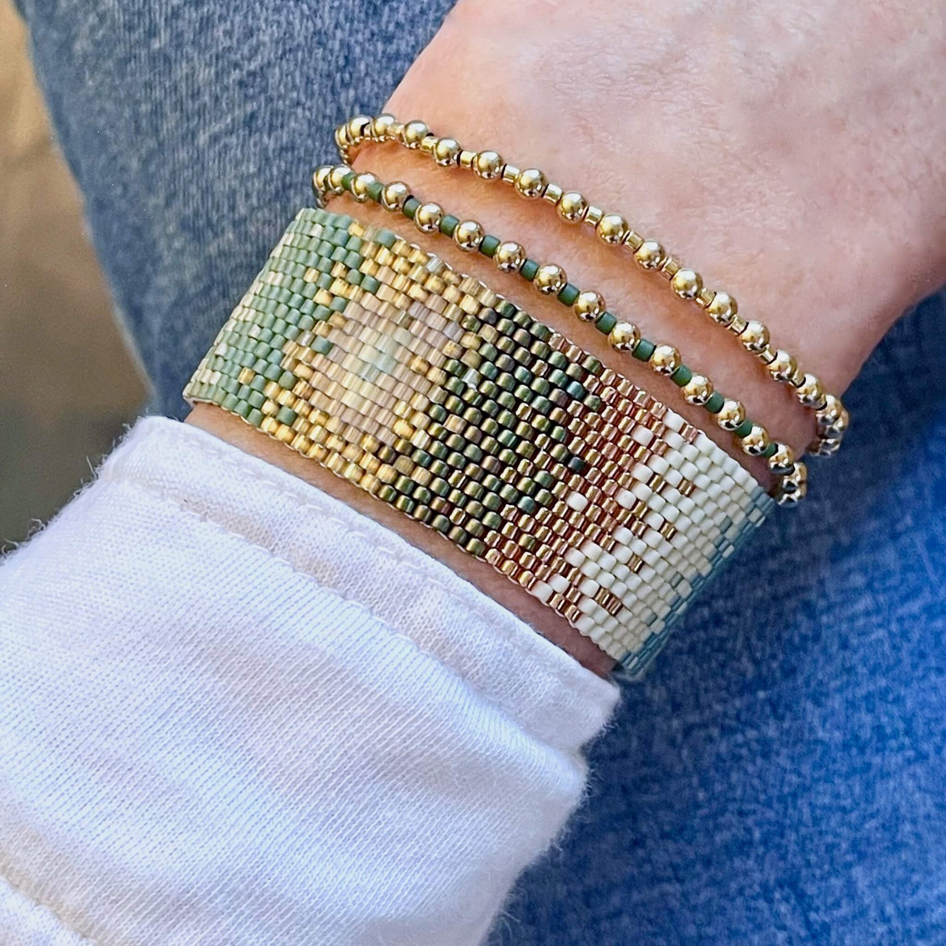 Modern boho ombre green and gold hand beaded peyote bracelet and gold and seed bead delicate stretch bracelet set.