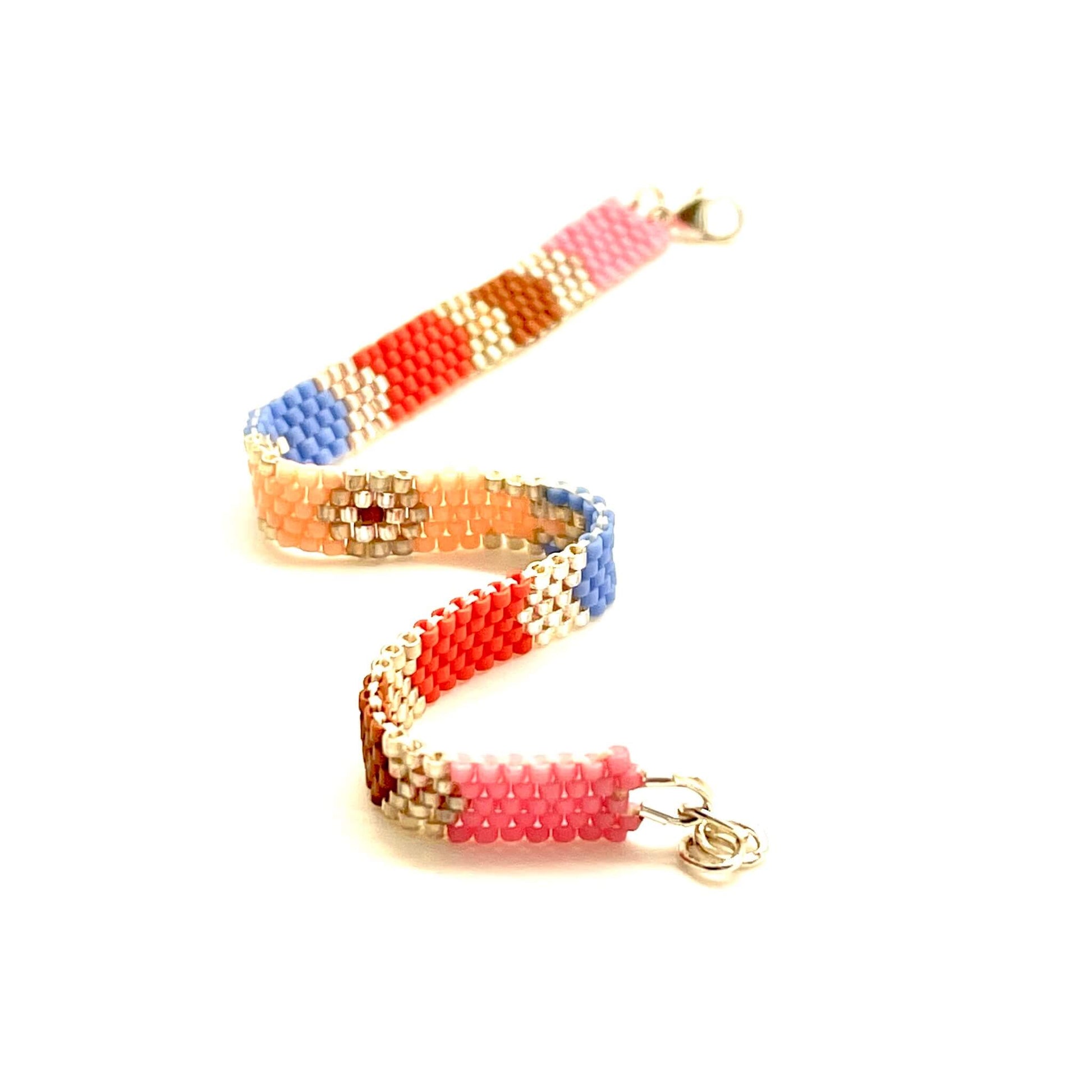 Peach, red, and blue peyote beaded bracelet with gold accents.