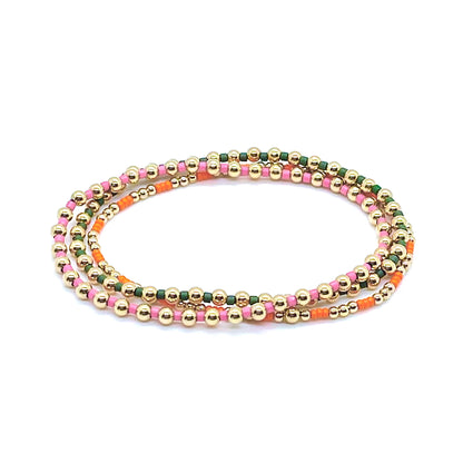 Pink, green, and orange gold ball stretch bracelet set of 3 with 2mm and 3mm 14K gold filled beads and tiny glass seed beads.