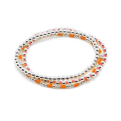 Brightly colored pink and orange tiny glass seed bead sterling silver stretch bracelet set of 3.