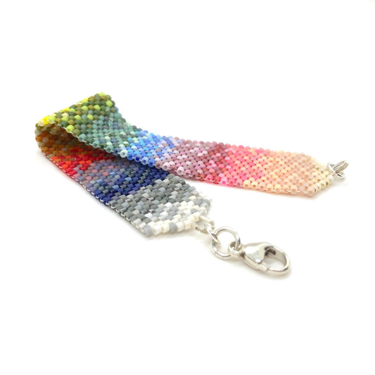 Ombre rainbow colors wide peyote hand woven beaded bracelet cuff with tiny Miyuki delica glass seed beads.