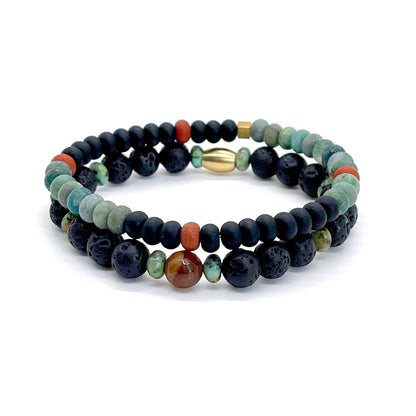 Men's green, red, and black gemstone beaded bracelet stack with jasper, agate, lava and raw brass beads.