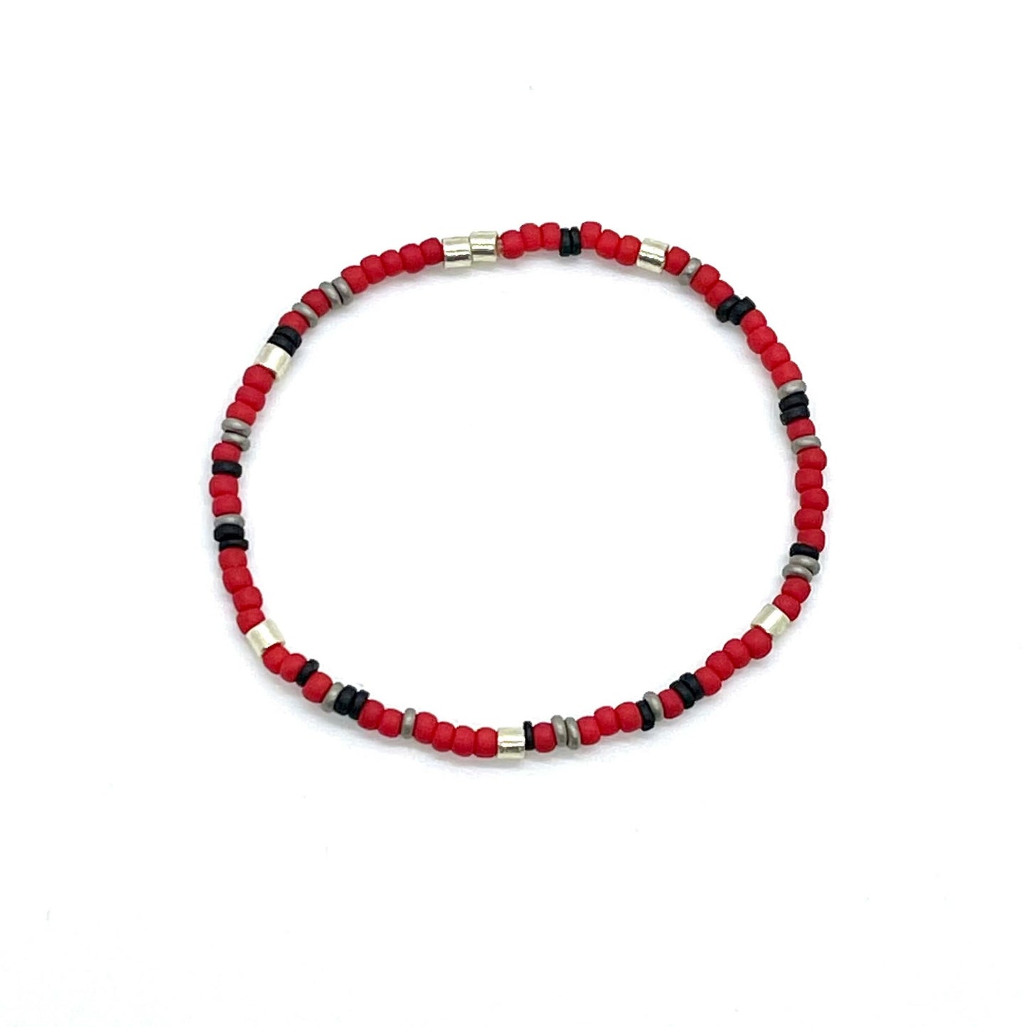 Red seed bead skinny stretch bracelet for guys with black and silver accent beads.