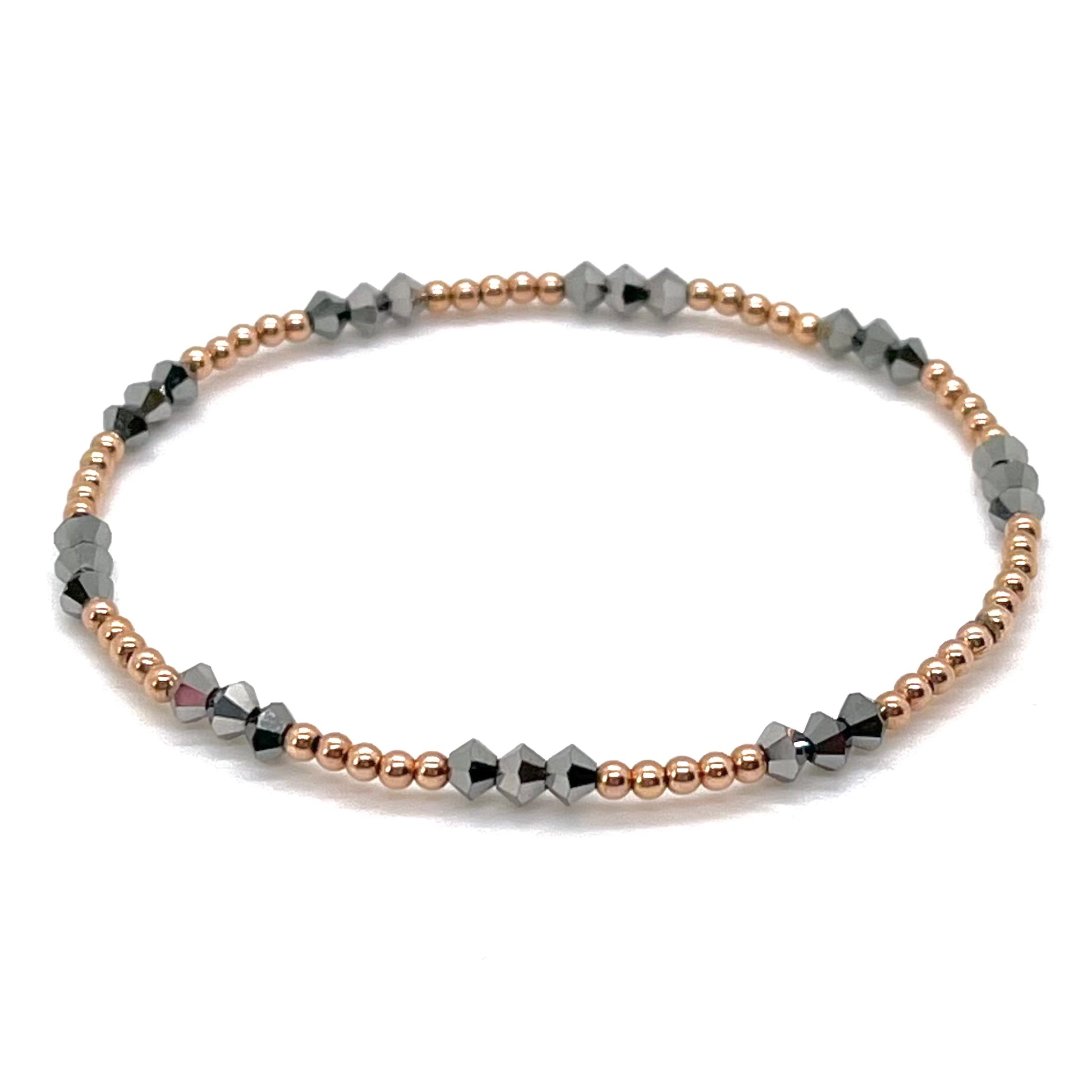 Rose gold bead bracelet with 2mm 14K gold filled balls and cyrstal hematite beads on elastic stretch.