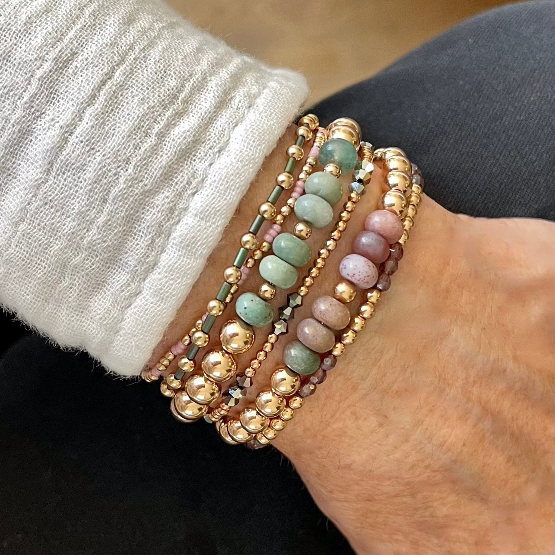 Rose gold bracelet stack with 6 sage and lilac gemstone and seed bead stretch bracelets