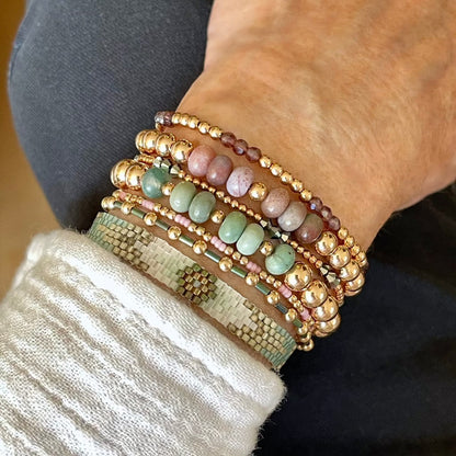 Sage and lilac women's bracelet stack with rose gold beads and woven thin cuff arrow band.