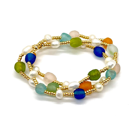 Sea glass and pearl bracelets in blue, green, or orange with freshwater pearls and gold tone seed beads. 