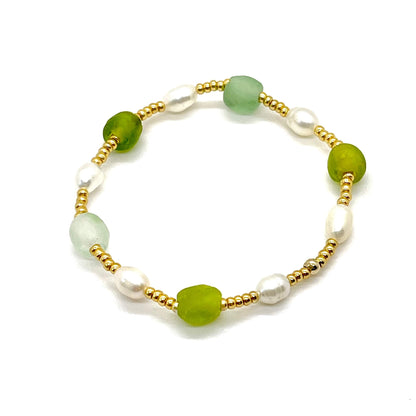 Sea glass bracelet with green beach glass, freshwater rice pearls, and gold tone seed beads.
