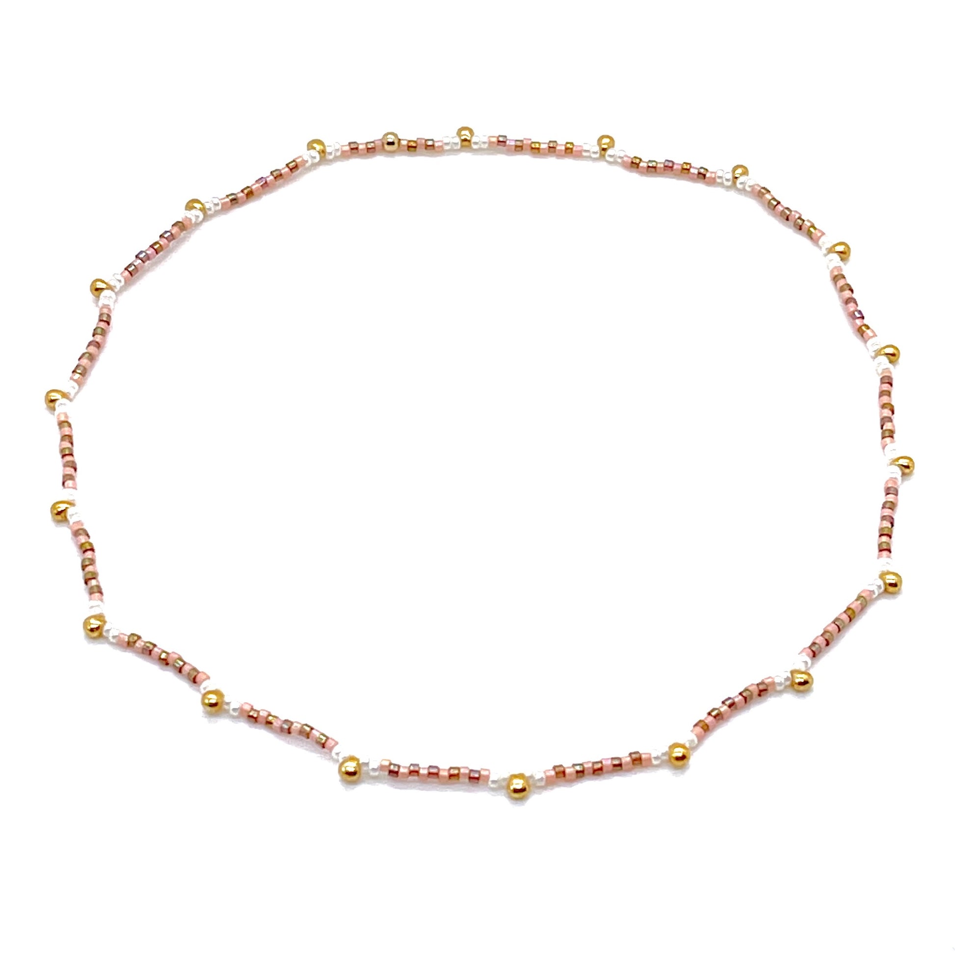 Seed bead choker necklace with peach, topaz, and pearl seed beads and gold-tone droplets. Beaded on elastic stretch.
