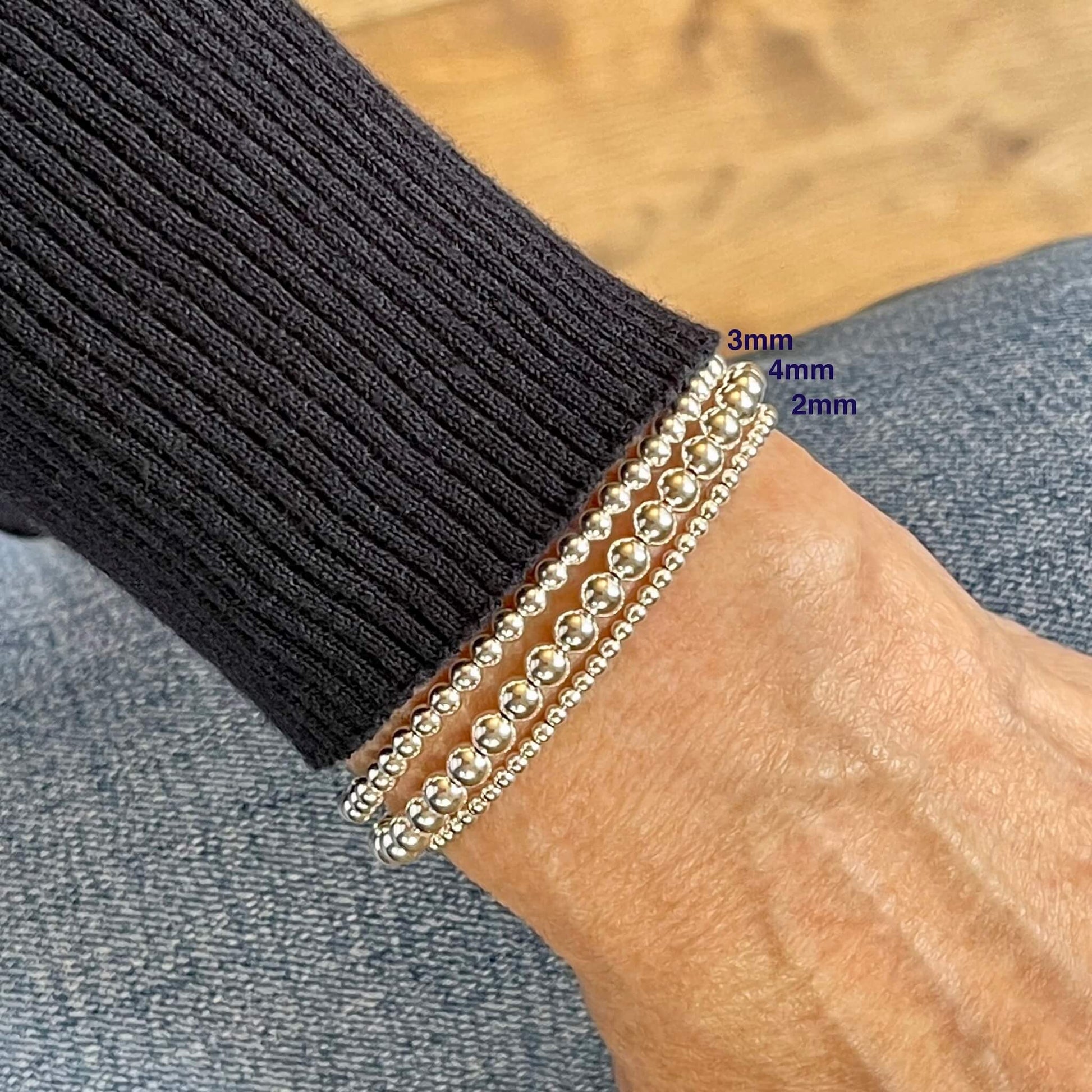 Silver bead bracelets with sterling silver beads. These stylish silver stretch bracelets are waterproof and tarnish resistant.