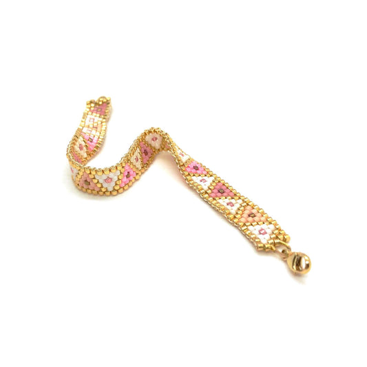 Modern geometric pink, peach, white, and gold triangle flat beaded bracelet soft cuff. Handmade in NYC.