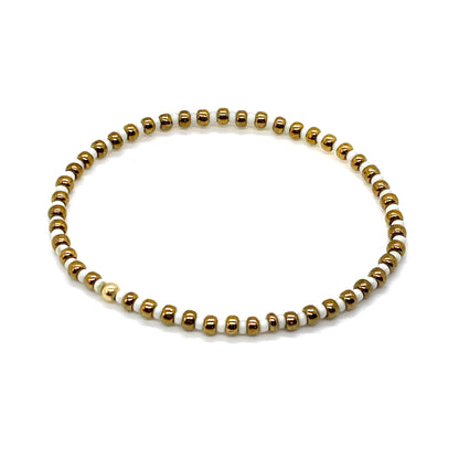 White and bronze skinny seed bead stretch bracelet.