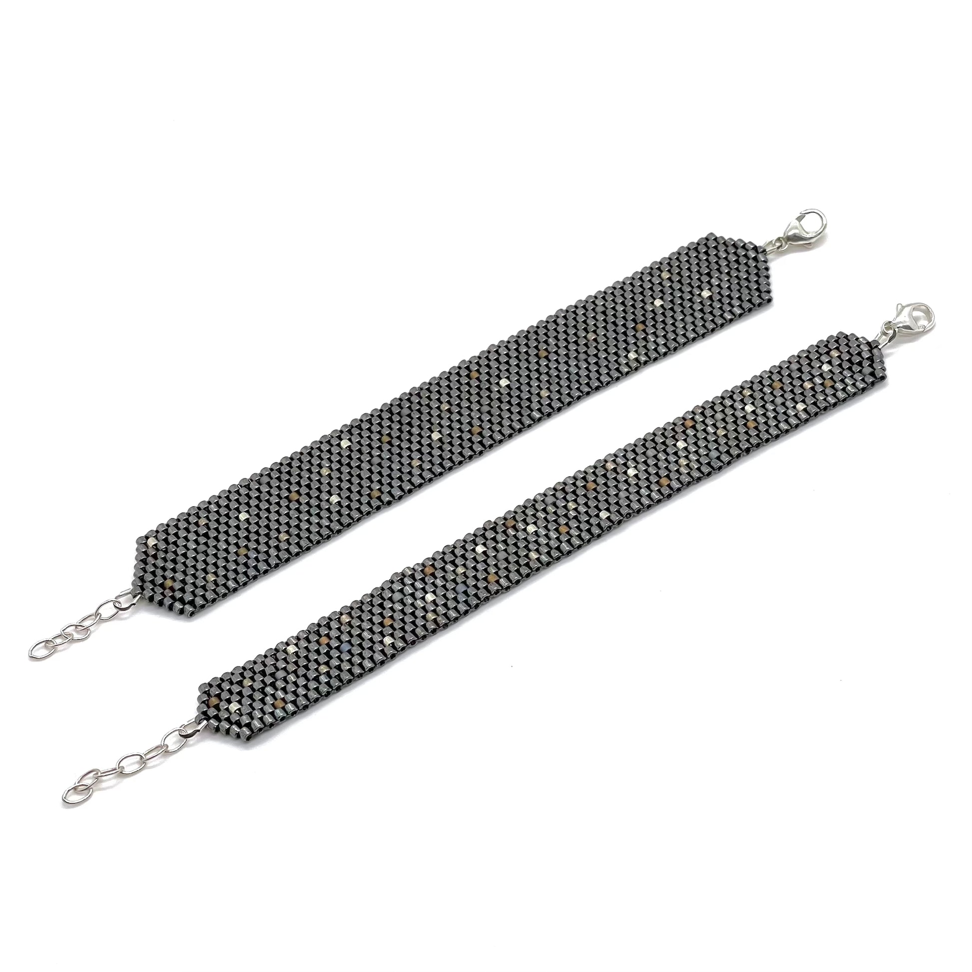 Wide and medium width gunmetal seed bead woven cuff bracelets.
