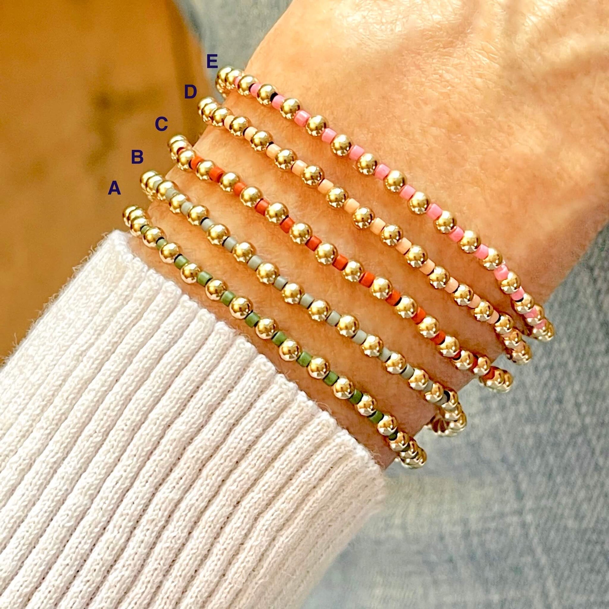 Women's gold bead bracelets with colorful seed beads on stretch cord. Handmade in NYC.