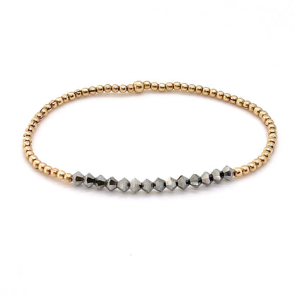 2mm gold ball stretch bracelet with black hematite crystal bicone iridescent beads.