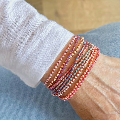 Multi strand bracelet set of 2 copper and pastel color bead wrap bracelets on stretch cord.