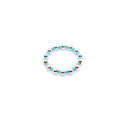 Beaded ring | 3mm sterling silver ball ring with alternating blue seed beads on stretch cord.