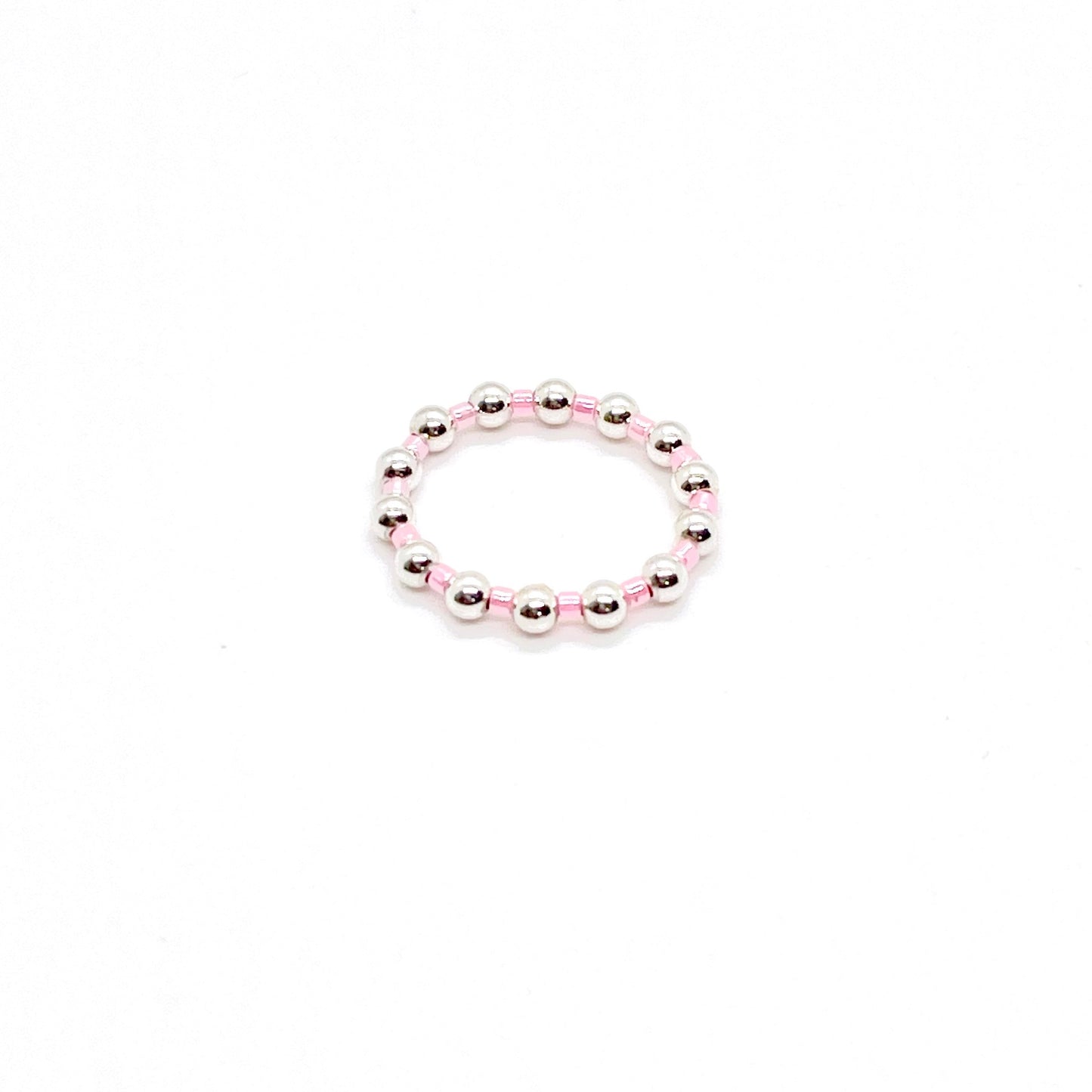 Beaded ring | 3mm sterling silver ball ring with alternating pink seed beads on stretch cord.
