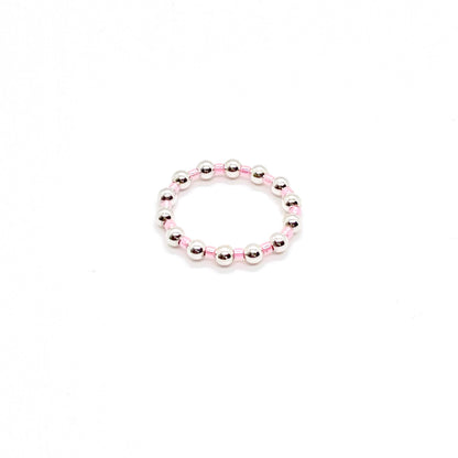Beaded ring | 3mm sterling silver ball ring with alternating pink seed beads on stretch cord.