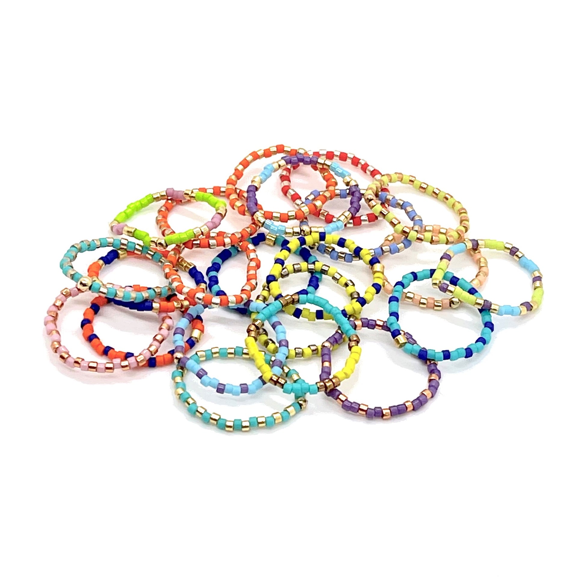 Beaded rings with colorful combinations of Miyuki Delica seed beads on stretch cord. Great for stacking.