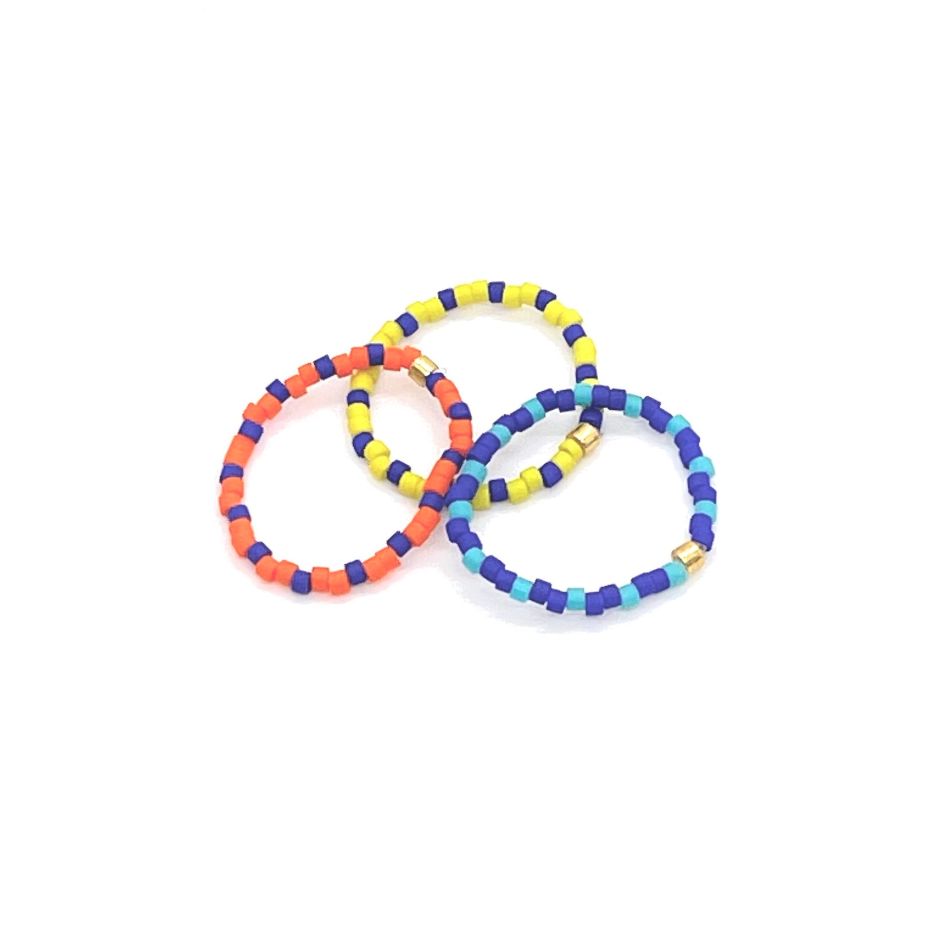 Beaded stretch ring set of 3 with alternating blue, orange, and yellow Miyuki Delica seed beads.
