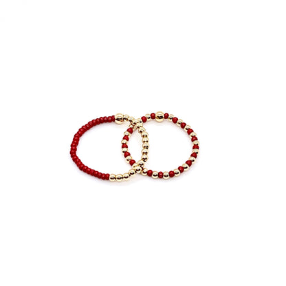 Stretch ring set with red color block and seed beads alternating with 2mm 14K gold filled balls on stretch cord.