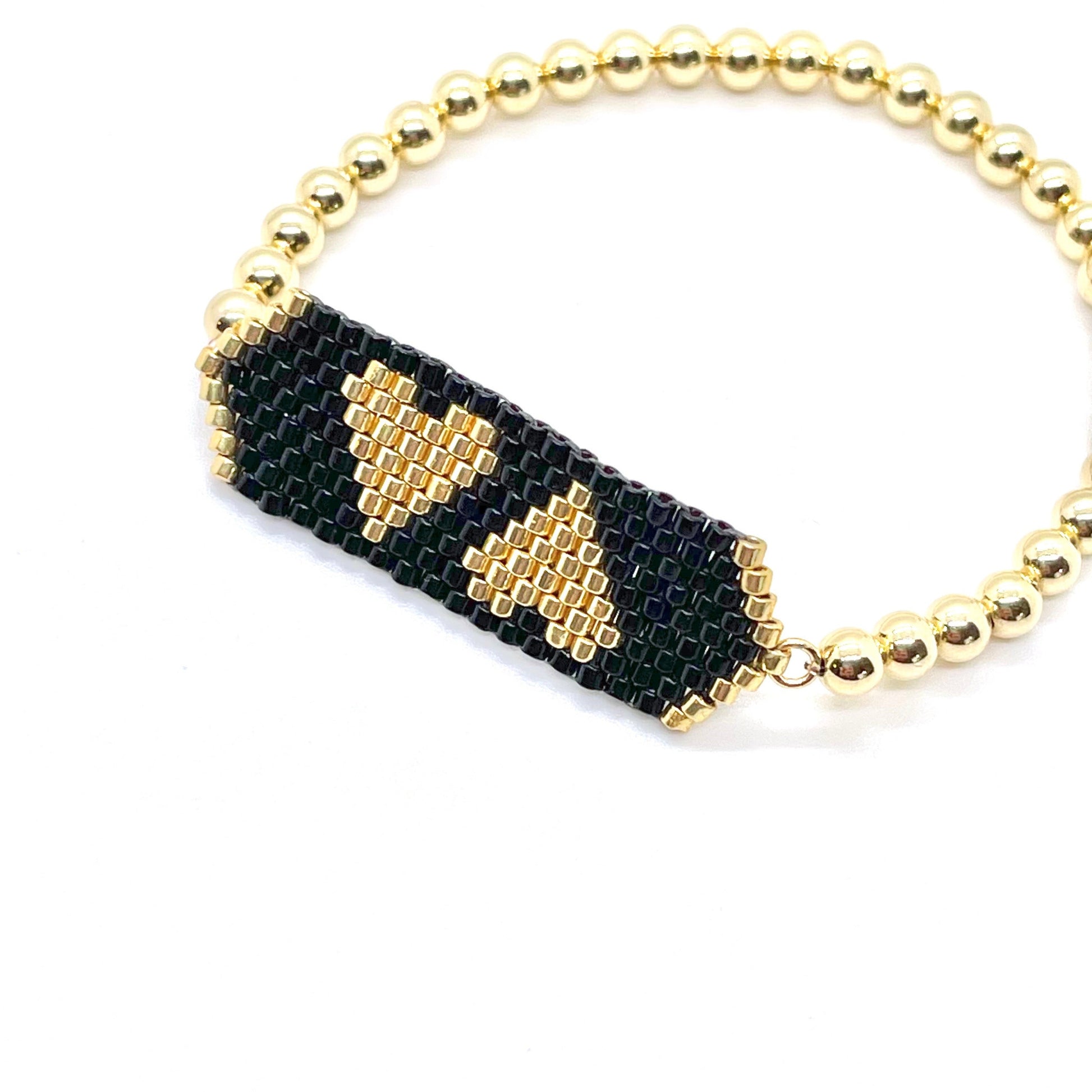 Heart beaded bracelet with black and gold seed beads on a 14K gold filled 4mm ball bracelet.