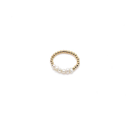 Freshwater pearls stretch ring with 2mm 14k gold filled beads and a row of freshwater button pearls in the center.