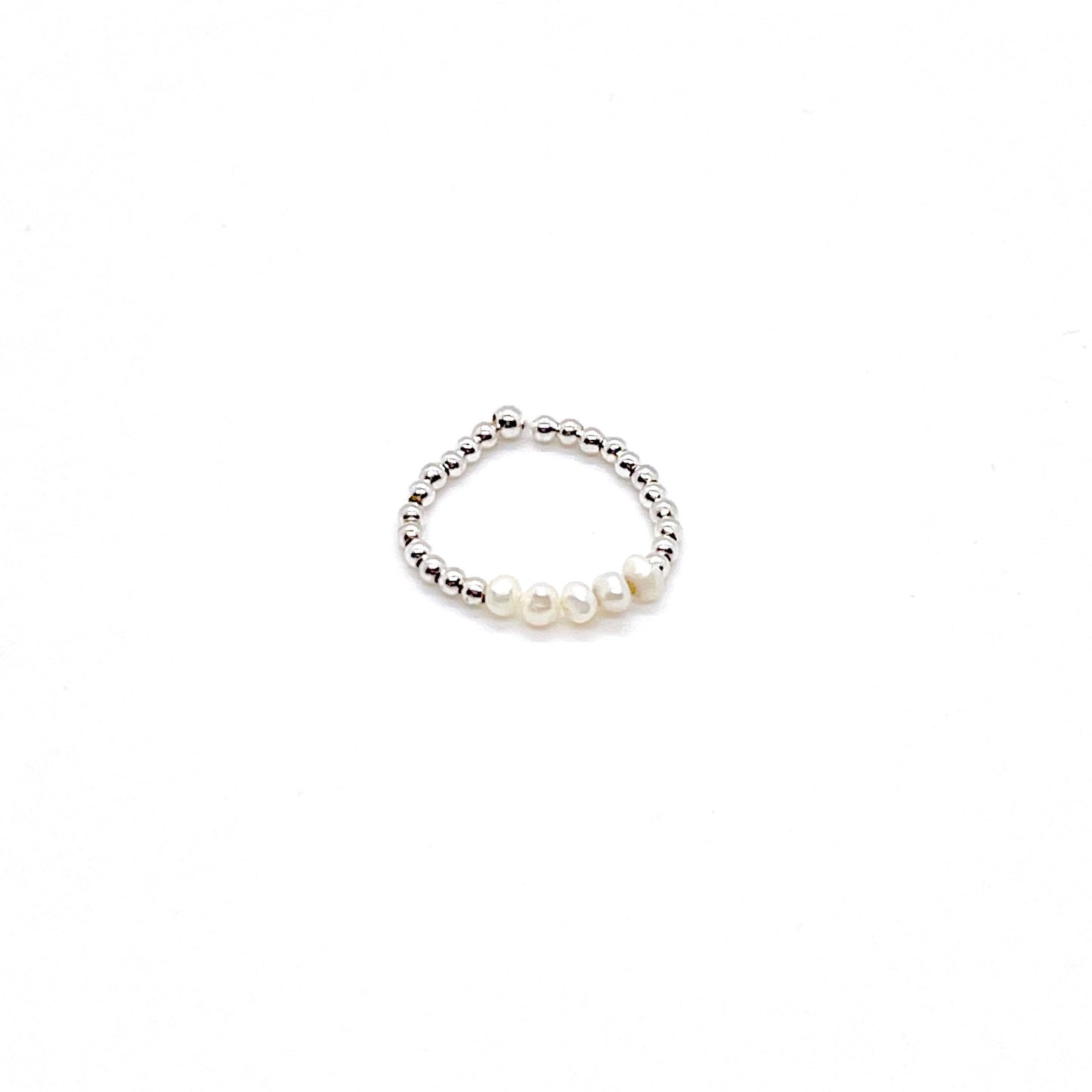 Freshwater pearls stretch ring with 2mm sterling silver beads and a row of freshwater button pearls in the center.