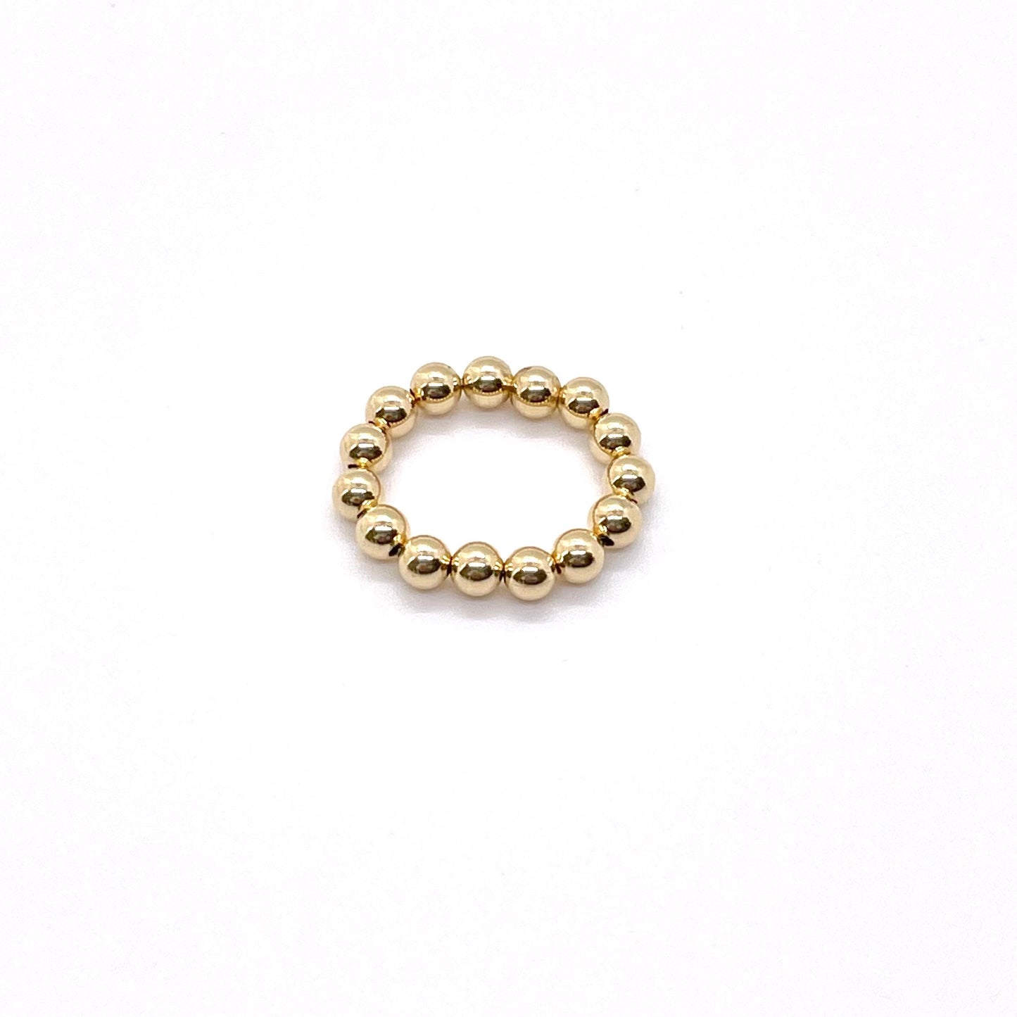 Gold ball ring with 4mm 14K gold filled waterproof beads on elastic stretch cord.