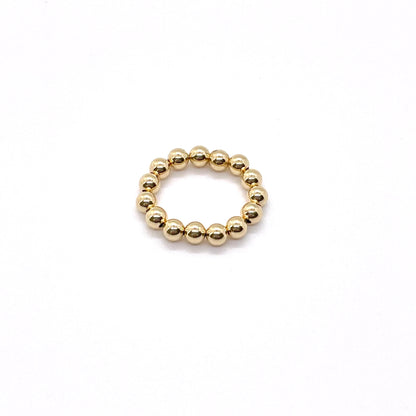 Gold ball ring with 4mm 14K gold filled waterproof beads on elastic stretch cord.