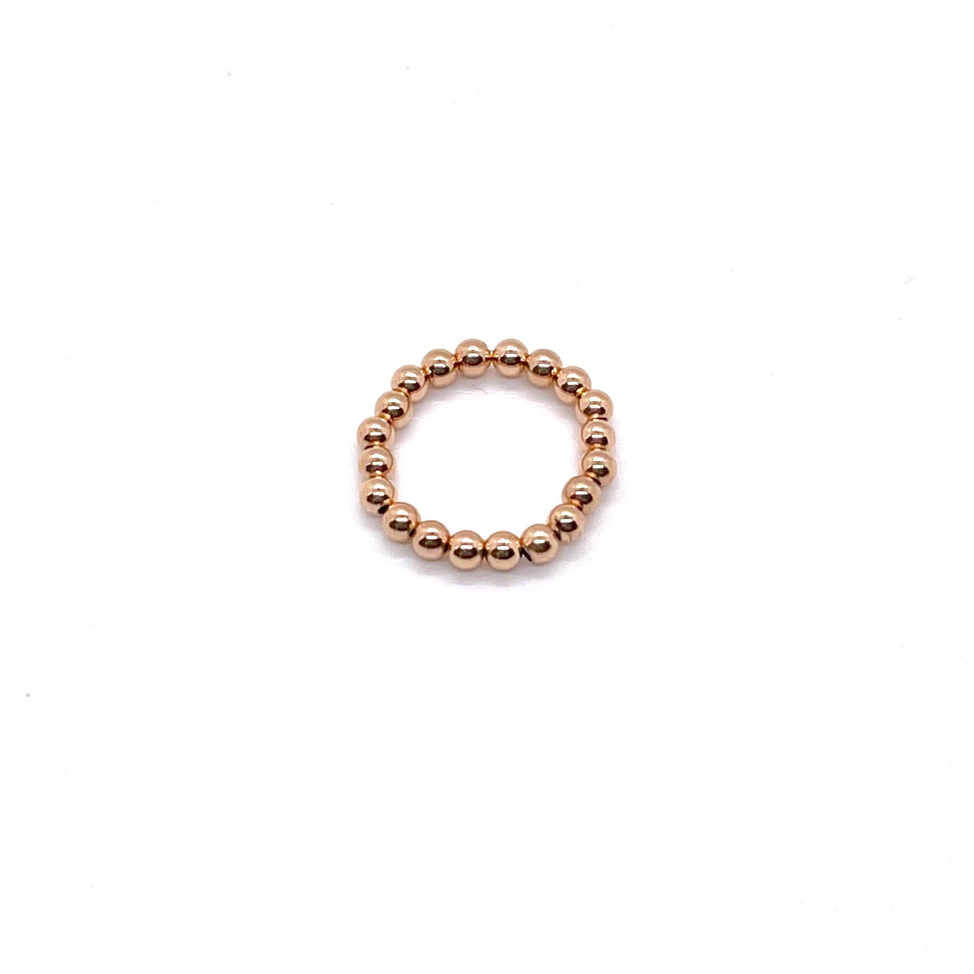 Gold beaded ring with 3mm rose gold filled waterproof beads on elastic stretch cord.