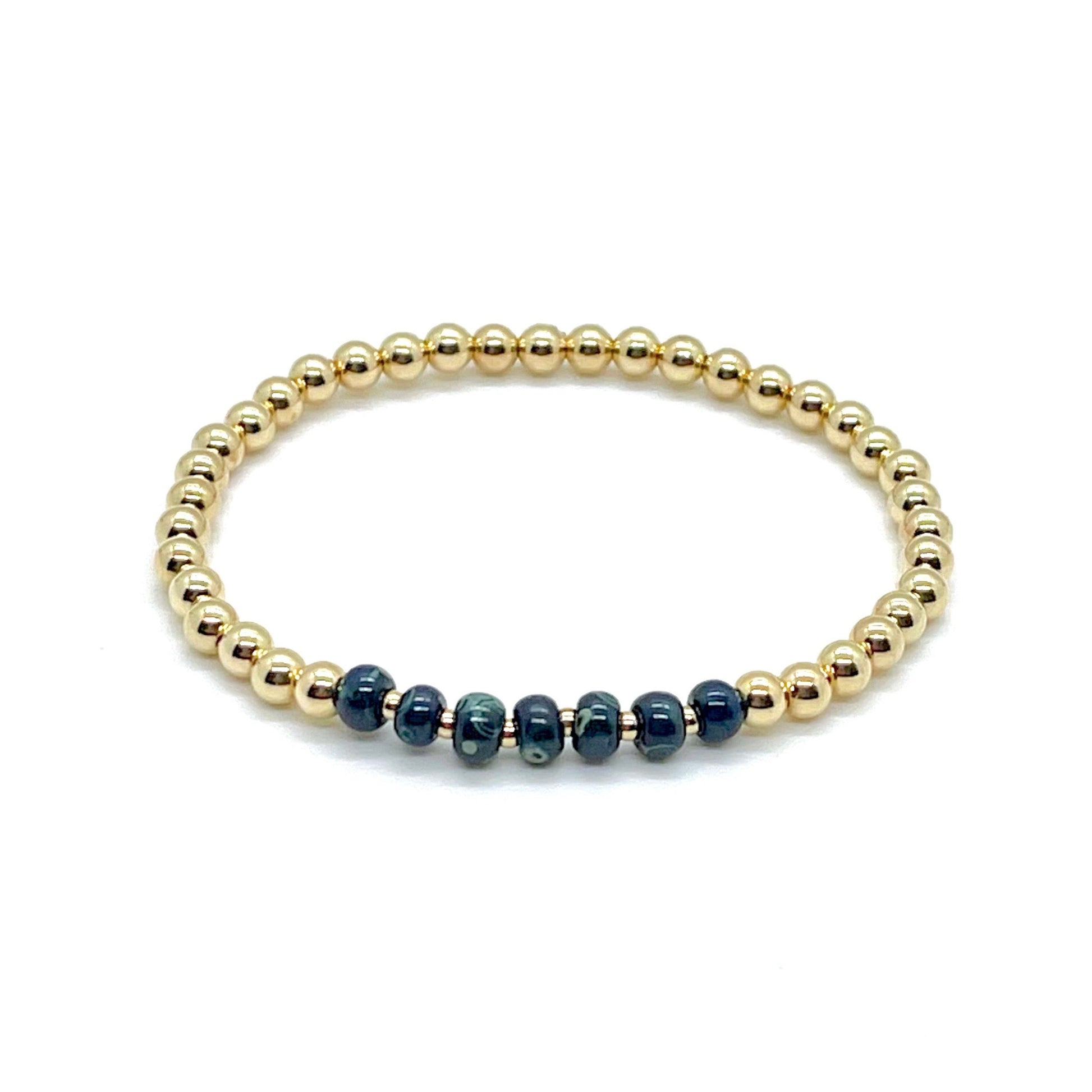 Tarnish resistant, water-safe, gold filled handmade beaded ball bracelet with large, blue marblized glass beads.