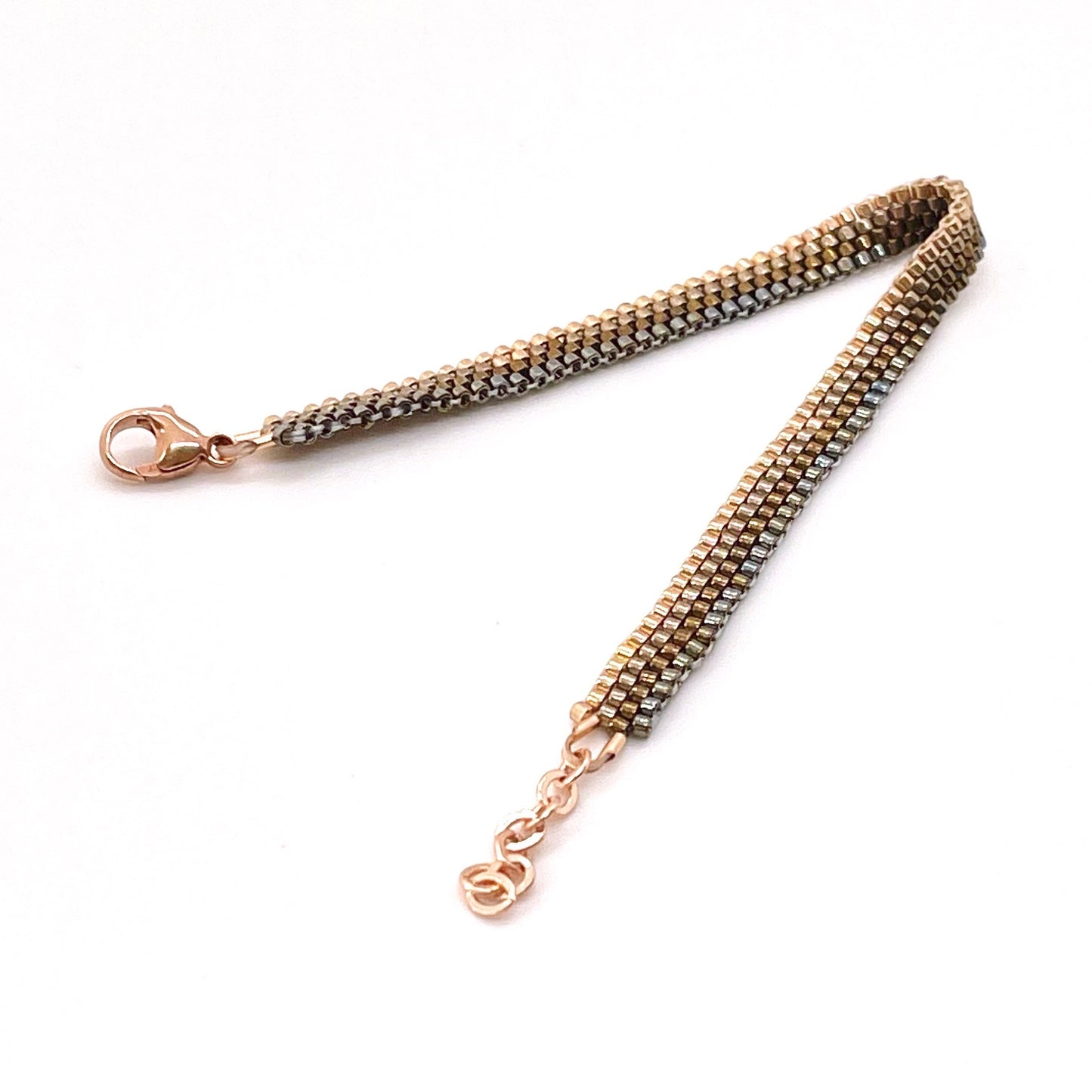 Horizontal stripes pewter/bronze metal tone seed bead  woven bracelet. Thin band with ombre stripe pattern.