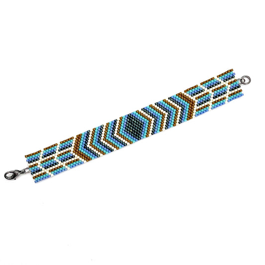 Flat beaded bracelet woven with navy, turquoise, and brown tiny beads. A fun and stylish beach or pool accessory.