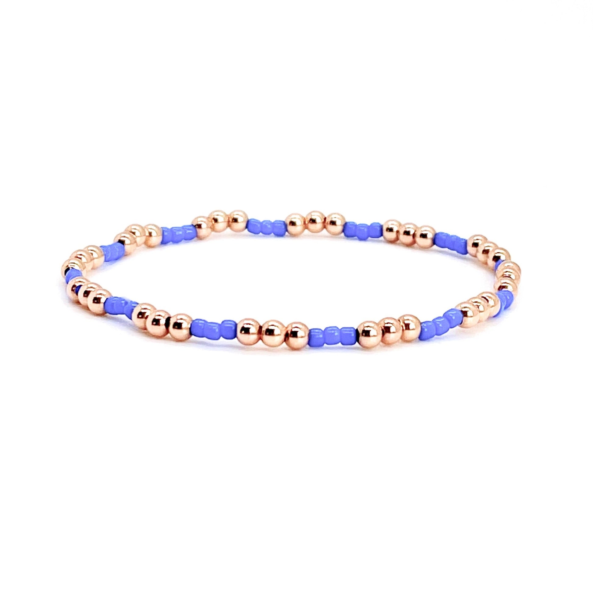 Rose gold bracelet for women with 3mm 14K beads and small seed beads on stretch cord.