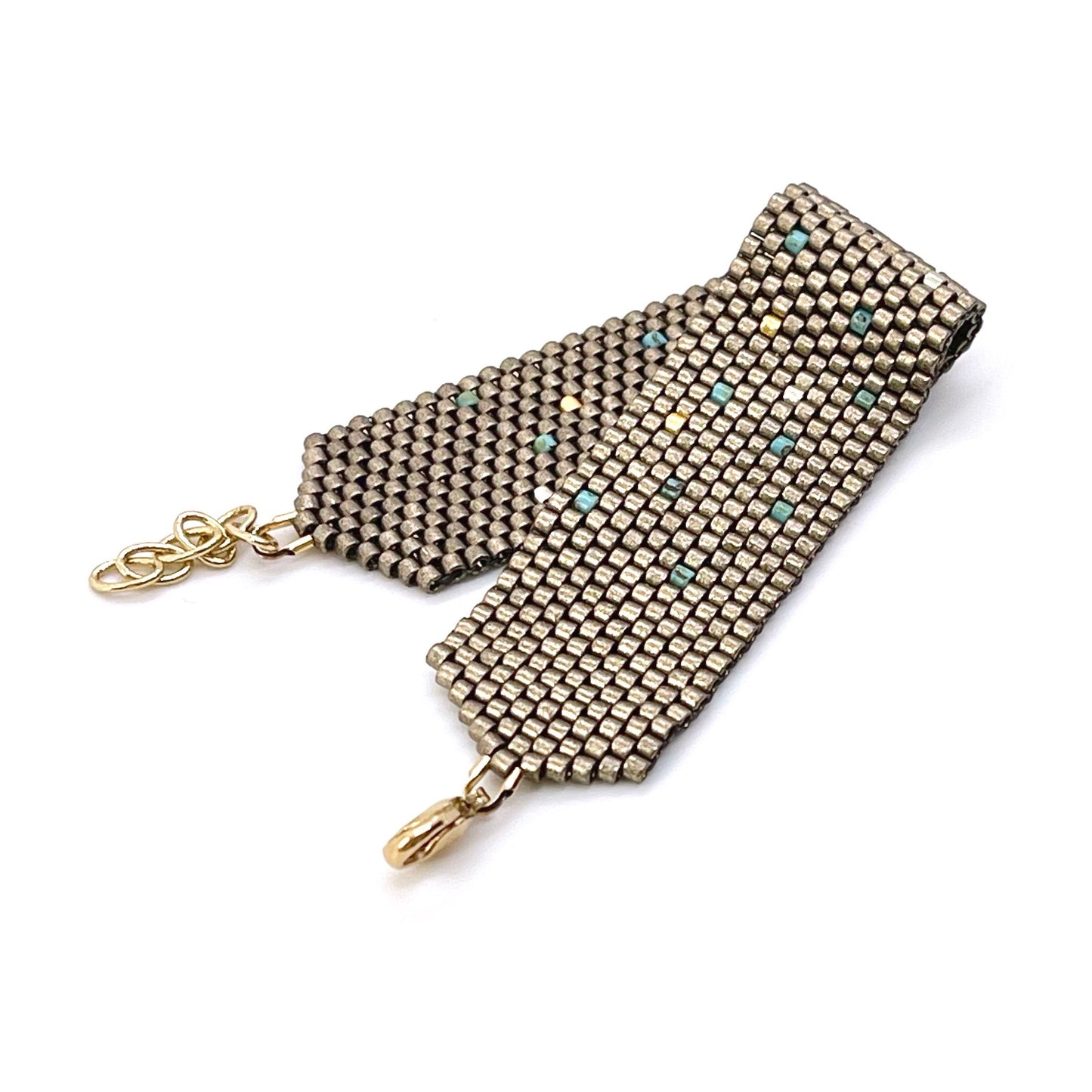 Pewter bracelet | Wide woven seed bead bracelet sprinkled with turquoise and silver/gold-tone beads.
