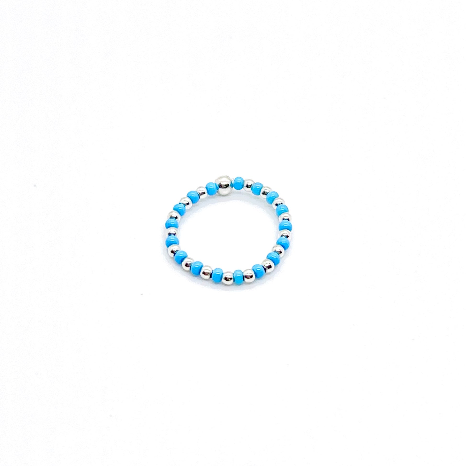 Seed bead ring | 2mm silver ball ring with alternating blue seed beads on stretch cord.