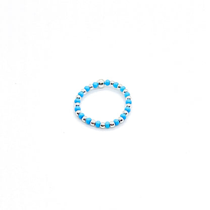 Seed bead ring | 2mm silver ball ring with alternating blue seed beads on stretch cord.