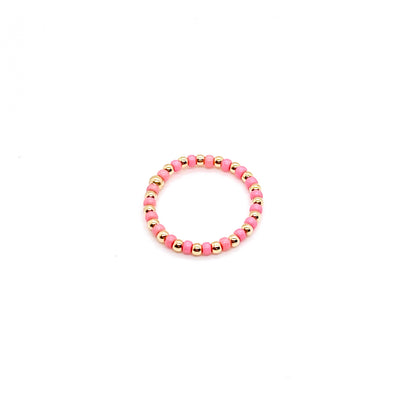 Seed bead ring with alternating 2mm gold ball and pink seed beads on stretch cord.