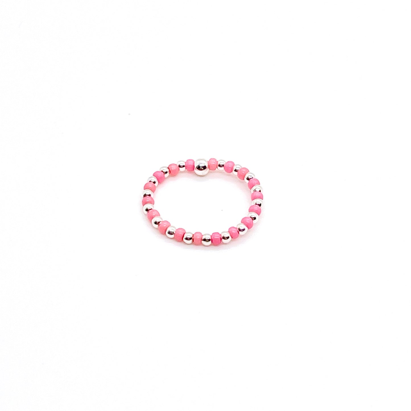 Seed bead ring with alternating 2mm silver ball and pink seed beads on stretch cord.