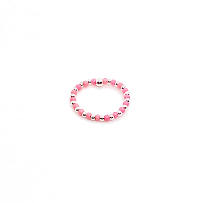 Seed bead ring with alternating 2mm silver ball and pink seed beads on stretch cord.