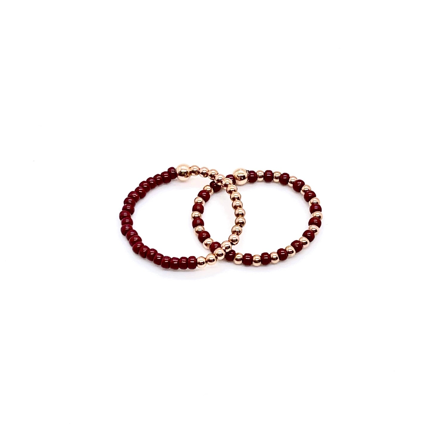 Stretch ring set with brown color block and seed beads alternating with 2mm 14K rose gold filled balls on stretch cord.
