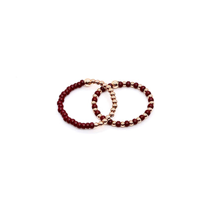 Stretch ring set with brown color block and seed beads alternating with 2mm 14K rose gold filled balls on stretch cord.
